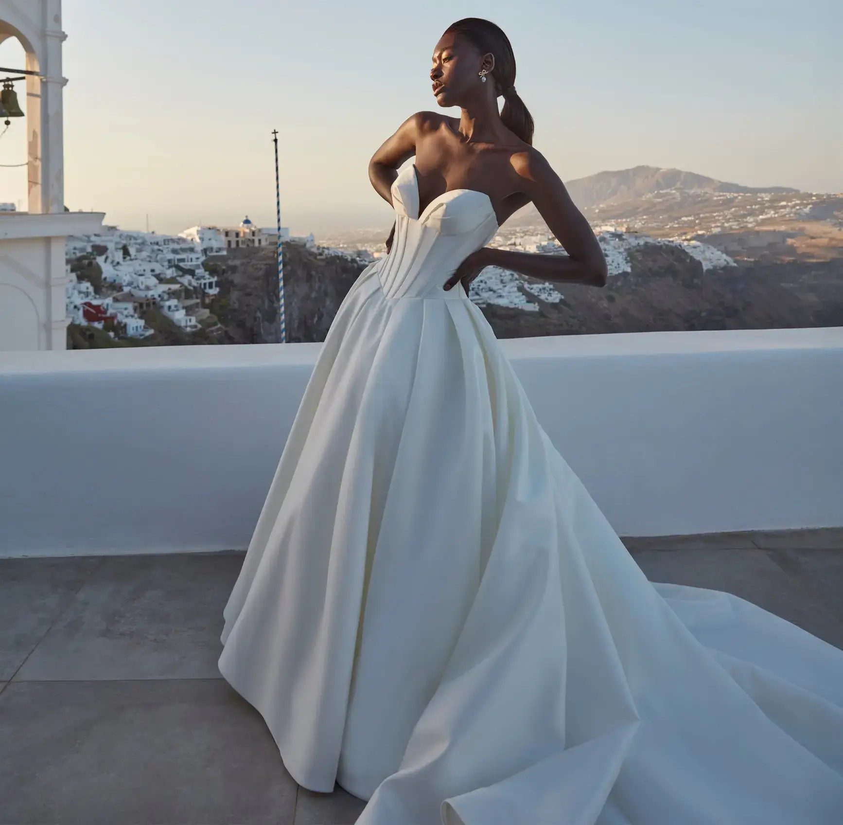 Model wearing a white Madison James dress